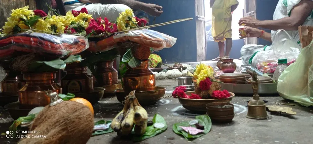 Sacred copper kalashas, coconuts, and Vedic offerings arranged for ritual sankalpa